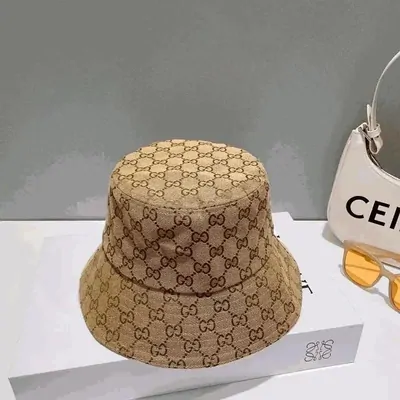 A monogram canvas bucket hat resting on its white box